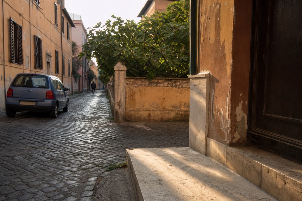 A quiet Roman residential street near a market quarter in morning light